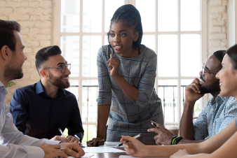 A person exhibiting leadership qualities as an informal leader among her coworkers. Source: Shutterstock