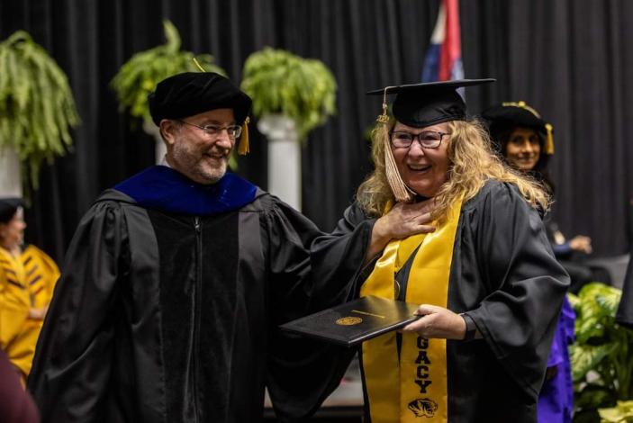 Jamie Wilson receiving her degree