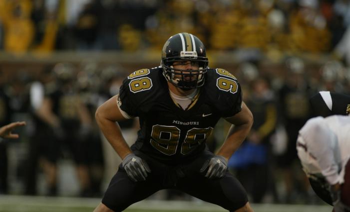 Matthew playing football against ISU