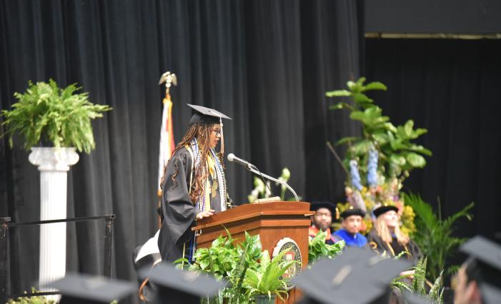 Jordan Walters addressing the graduating class at the Trulaske College of Business commencement ceremony